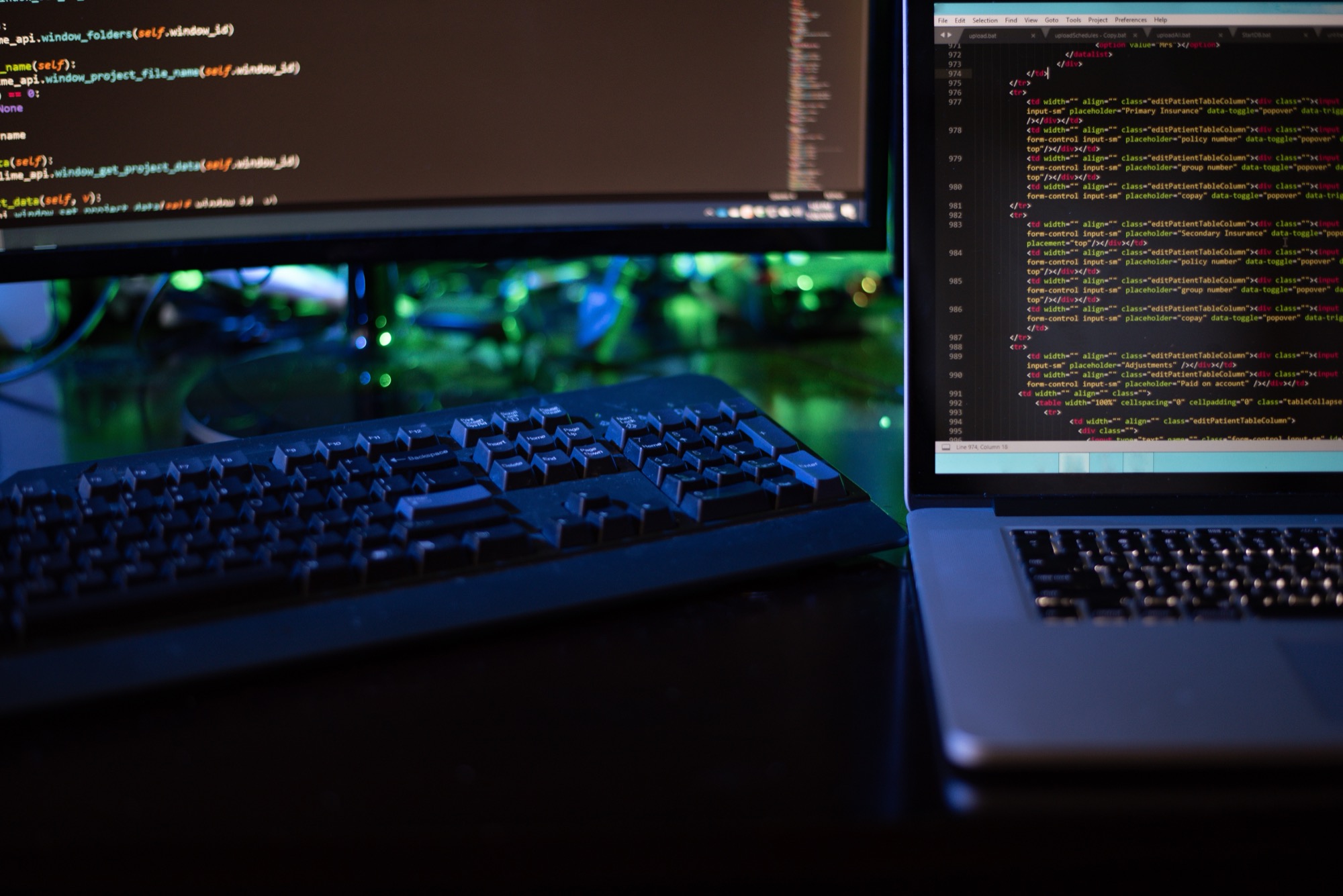 three-computer-screens-with-computer-programming-c-2024-11-01-02-32-31-utc